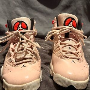 This is a pair of Nike Air Jordan 6 Rings GS 'Atmosphere' sneakers
